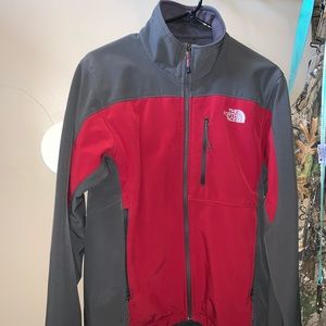 Gray and red north face jacket